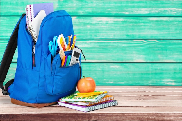 School backpack with stationery closeup view