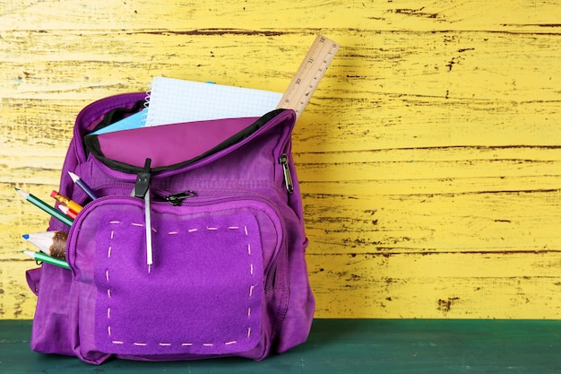 Photo school backpack on wooden background