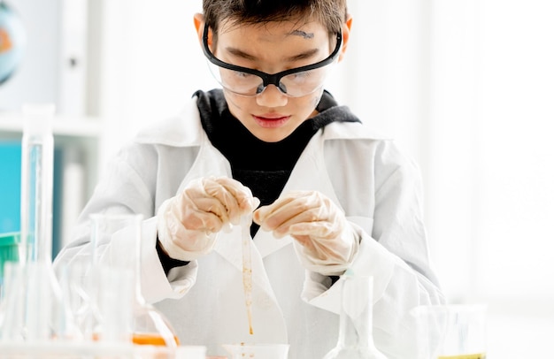 School boy in chemistry class