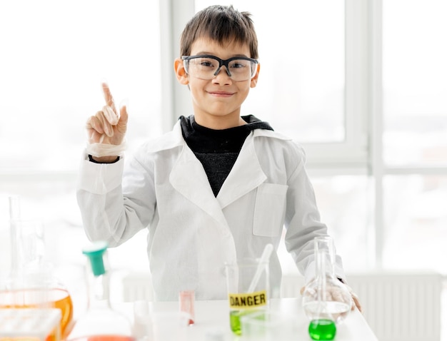 School boy in chemistry class