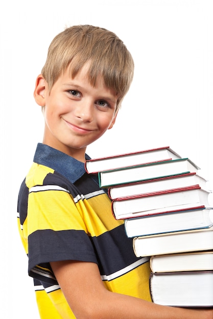 School boy is holding books