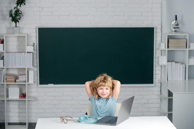 School boy studying math during online lesson in classroom online education