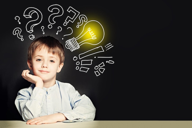 School boy with lightbulb on background Idea concept