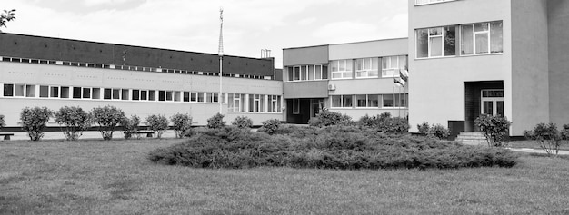 School building architecture exterior around courtyard with
green space campus