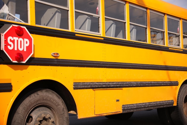 A school bus with a stop sign on the side of it