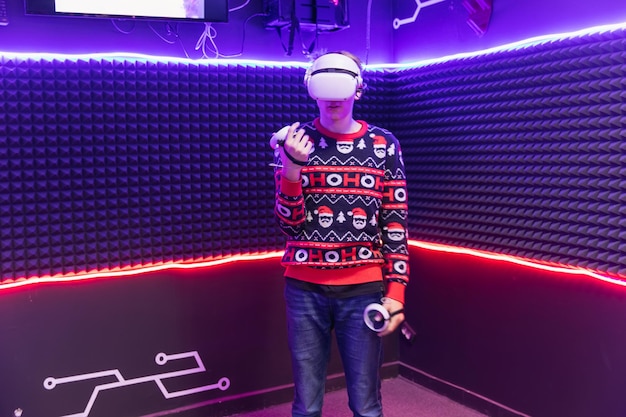 Photo school child boy in virtual reality glasses playing 3d game with hands trying to touch something 3d gadget technology