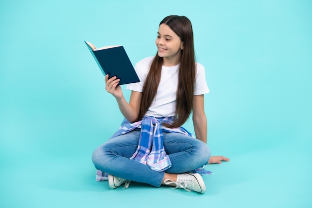 School child with book Learning and education Happy teenager positive and smiling emotions of teen schoolgirl