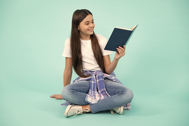 School child with book Learning and education Happy teenager positive and smiling emotions of teen schoolgirl