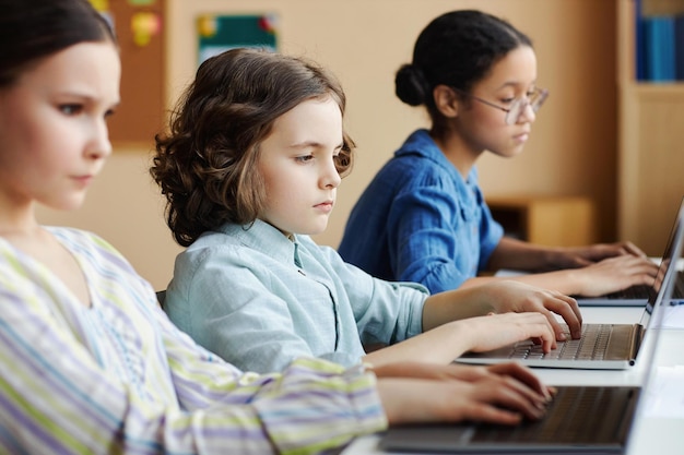 School children using computers in class