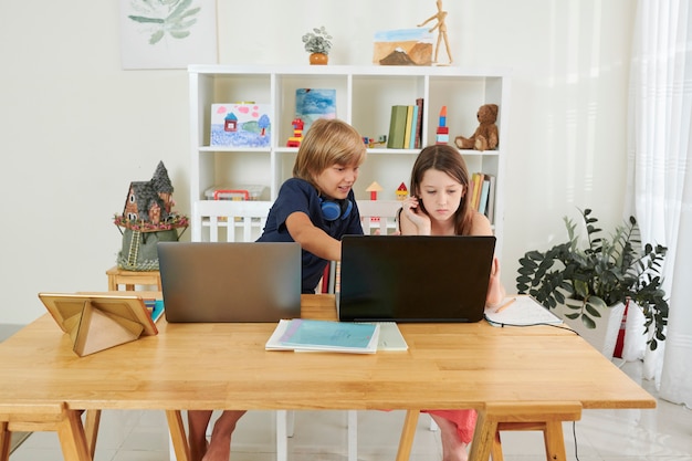 School children with laptops