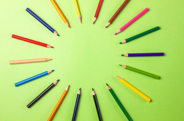 School creative concept. School supplies on green background. Copy space.