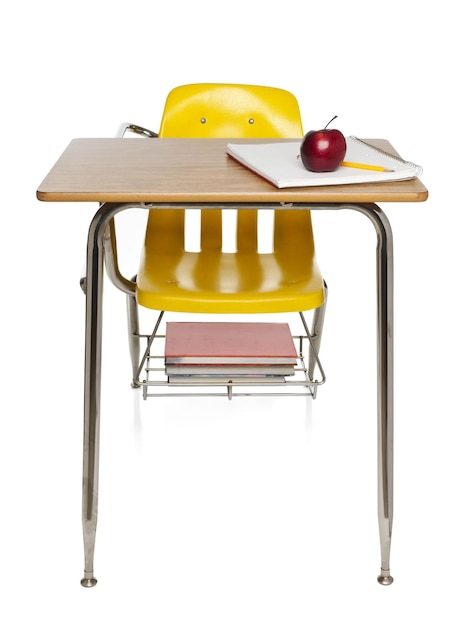 School desk with book and chair on white background