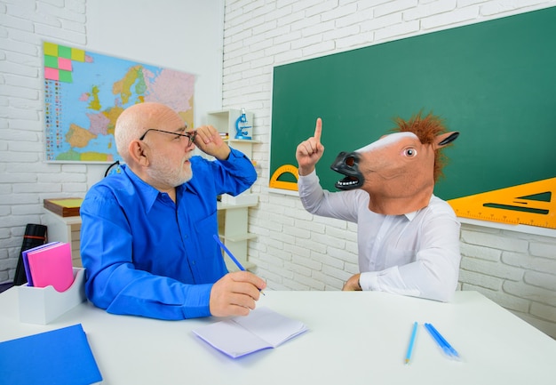 School. Funny teachers. Back to school. Crazy teacher. Education. Bearded teacher. Classroom. Crazy people. Funny teachers portrait.