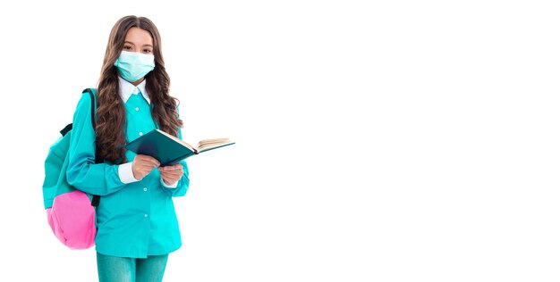school girl in mask reading book school quarantine photo of girl in quarantine mask