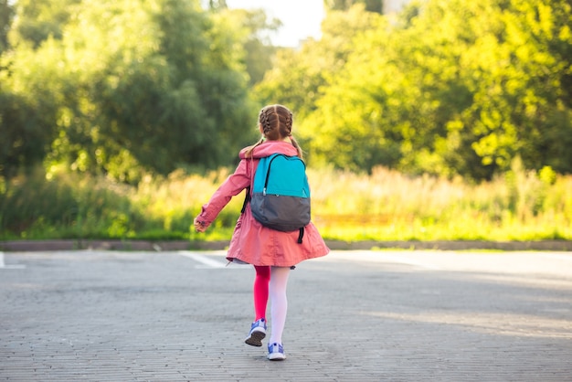 School girl running after lessons