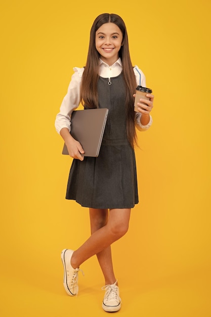 School girl with take away cup of cappuccino coffee or tea child with plastic takeaway mug morning drink cocoa beverage