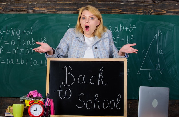 School. Home schooling. surprised woman. teacher with alarm clock. Time. Study and education. Modern school. Knowledge day. Back to school. Teachers day. woman in classroom. Student on exam.