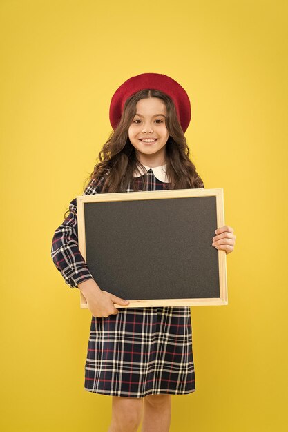 School information Informing you Expect the unexpected Child promo information board Place for information Girl hold blank blackboard Advertising product copy space Back to school concept