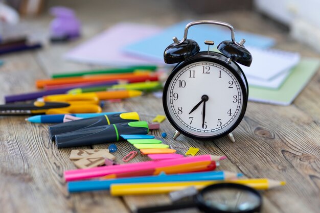 school items on wooden boards