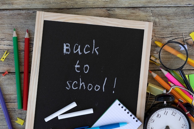 School items on wooden boards