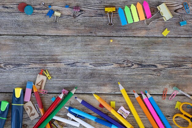 School items on wooden boards