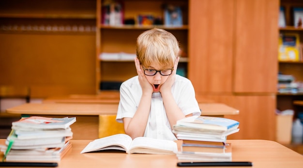 School kid education student boy studying books little child in glasses abacus clock