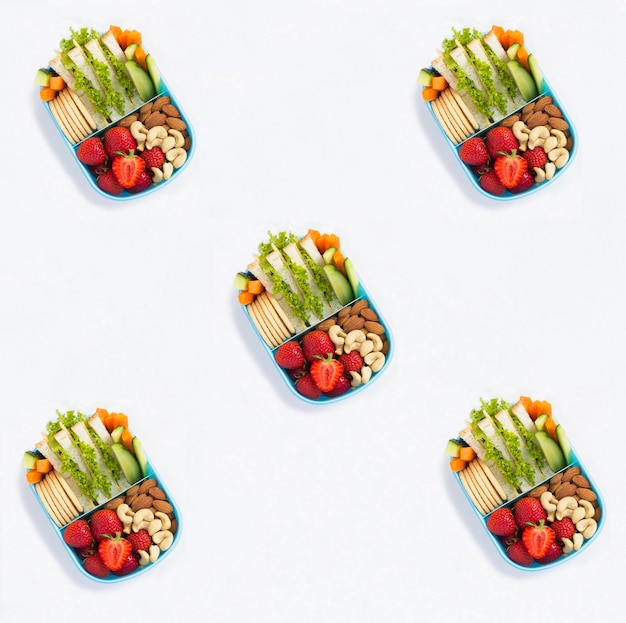 School lunch in the blue box on the white background Pattern Flat lay