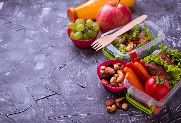 School lunch. Salad, sandwiches, fruits and nuts