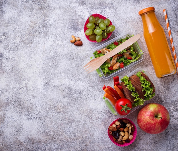 School lunch. Salad, sandwiches, fruits and nuts