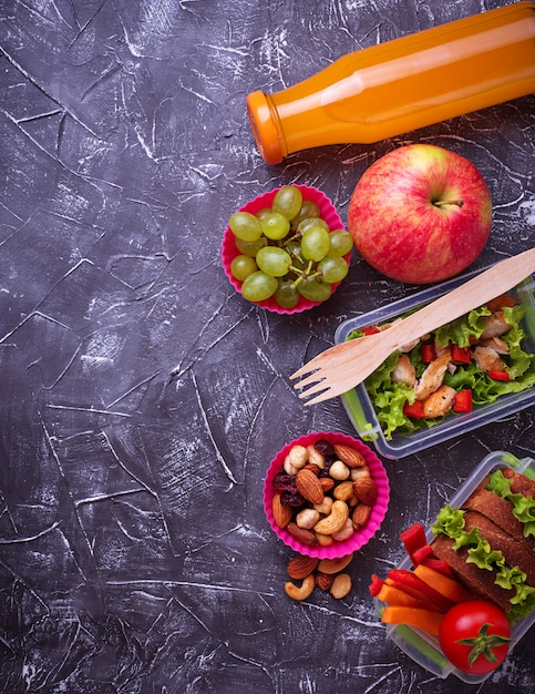 School lunch. Salad, sandwiches, fruits and nuts