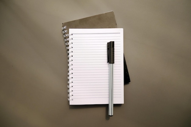 School notebook on a gray background spiral notepad on a table Mockup Copy space