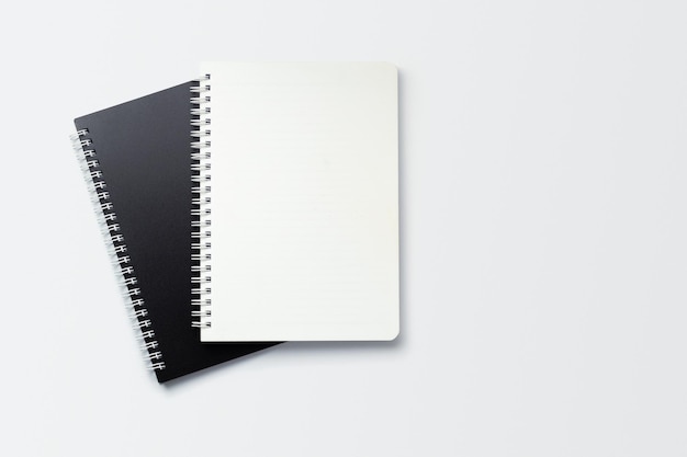 School notebook on a white background, spiral notepad on a table. flatlay