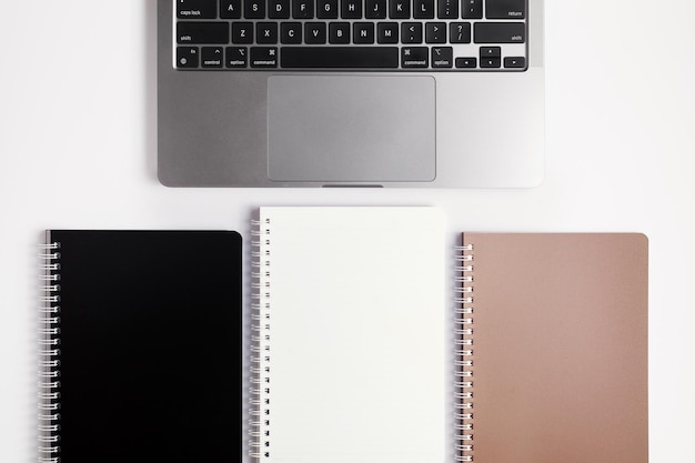 School notebook on a white background, spiral notepad on a table. flatlay