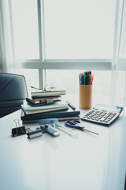 School and office stationary on white desk in office