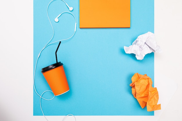 School and office supplies lie neatly on a white and blue wall