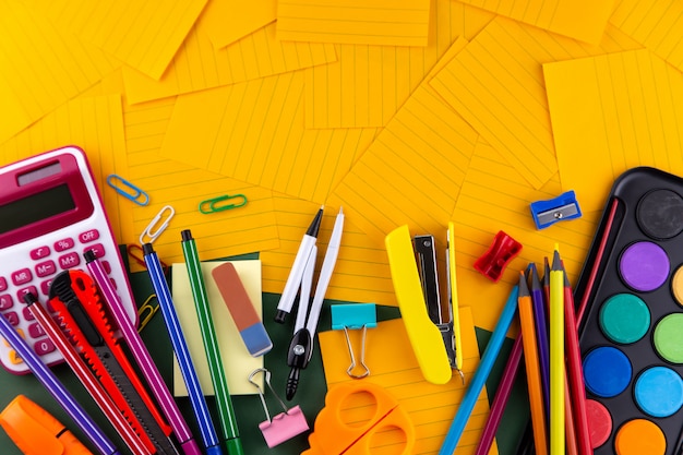 School office supplies stationery on orange paper