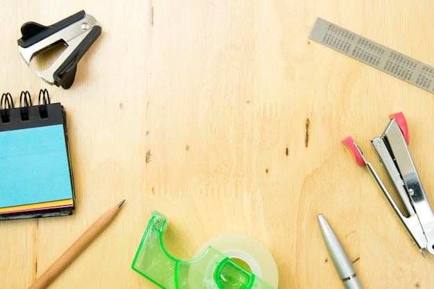 School and office supplies on wood background. top view, flat lay concept.