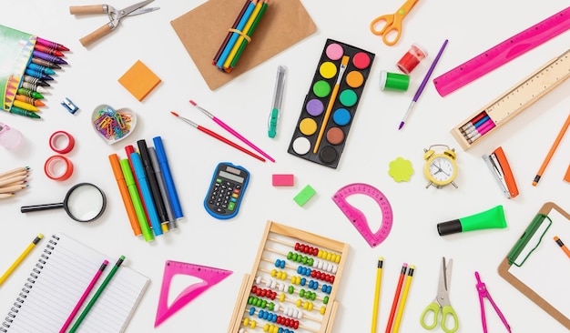 School office supply and stationery flat lay on white top view Back to school background