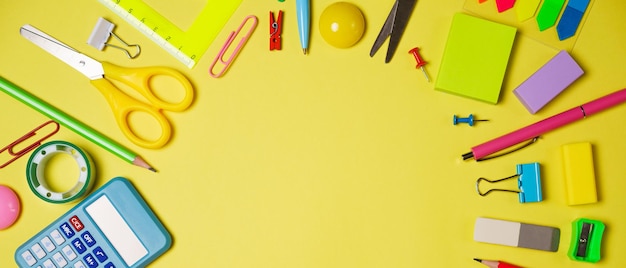 School or office workspace with colored supplies in form circle with space