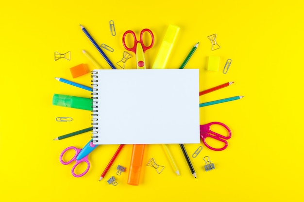 School open empty mockup notebook and various colored stationery. 