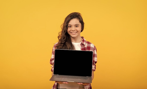 School presentation on computer kid ready for video lesson teen girl with laptop on head