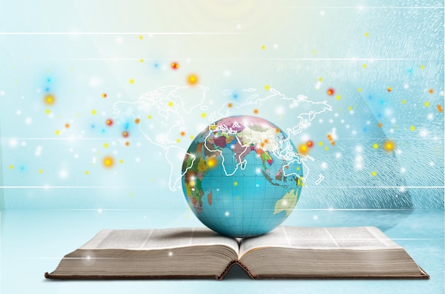 school stationery composition. globe on table and book