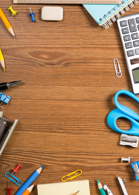 School stationery composition on wooden background