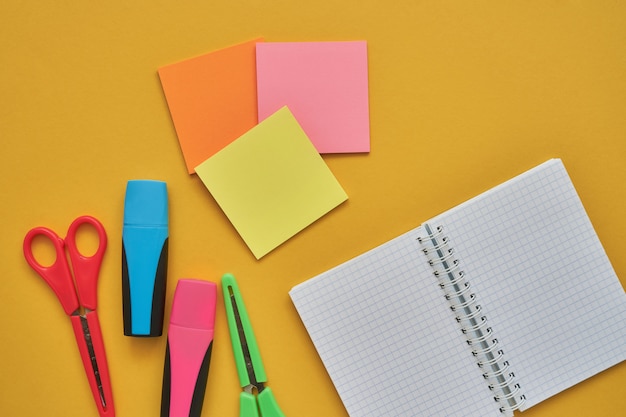 School subjects on a yellow background. Back to school concept. Flat lay, copy space