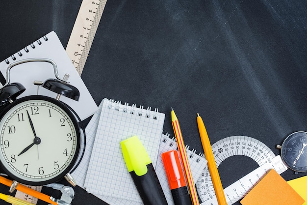 School supplies on the background of the teachers' board