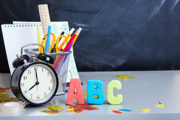 School supplies on the background of the teachers' board