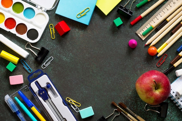 School supplies on a black table