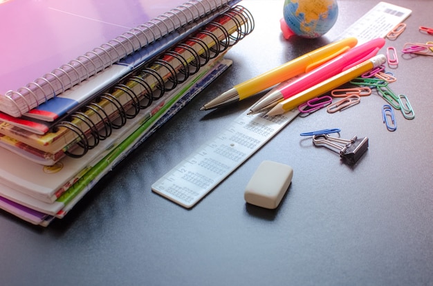 Photo school supplies on blackboard background