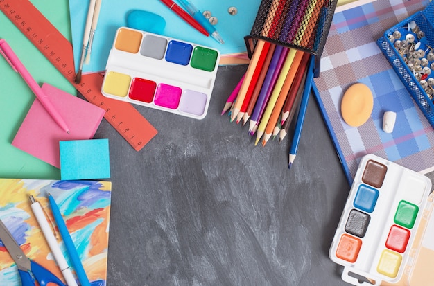 School supplies on a blackboard