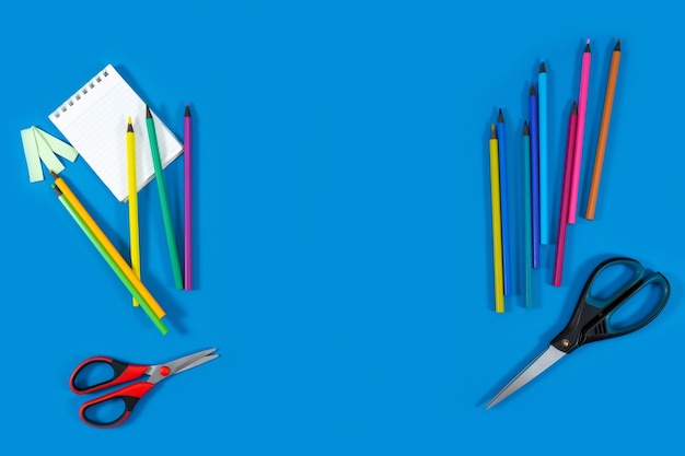 School supplies on a blue background Back to school